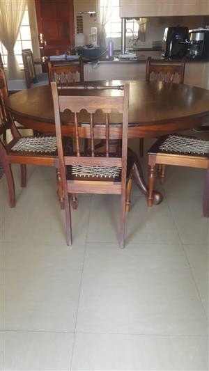 Black wood round dining room table with 5 chairs
