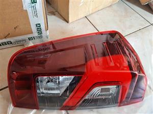 NISSAN NAVARA DOUBLE CAB TAIL LIGHTS. ORIGINAL. BRAND NEW. FOR VARIOUS OTHER CARS TOO