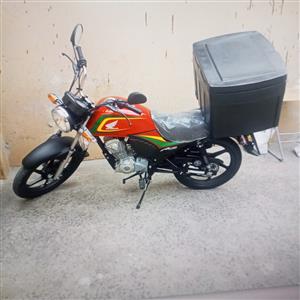 Delivery Honda scooter with a loading bin. Scooter have never been used before.