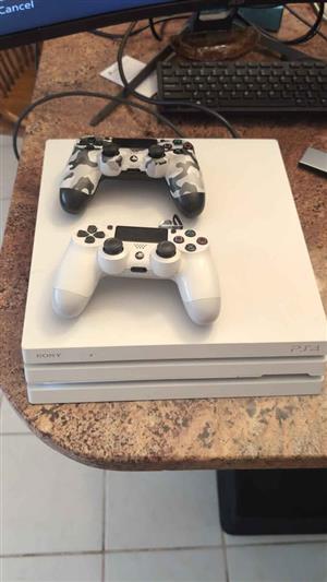Ps4 Pro limited white edition two controllers And 17 playstation disc games 