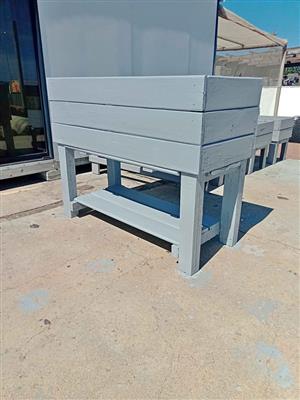 Painted raised planter with bottom shelf