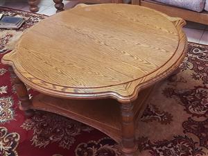 Round oak coffee table with lower shelf (part of set).