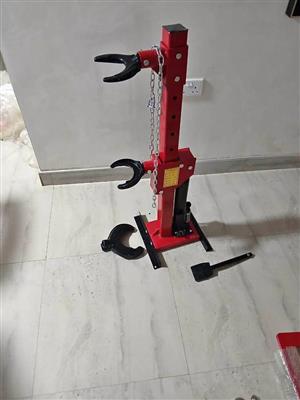 HYDRAULIC  SHOCK SPRING COMPRESSOR
