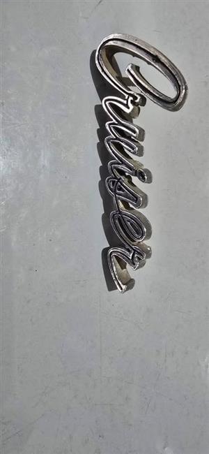 1960's Oldsmobile Cruiser Badge.