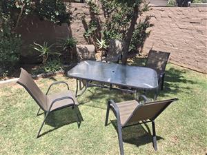 Glass table with 4 chairs