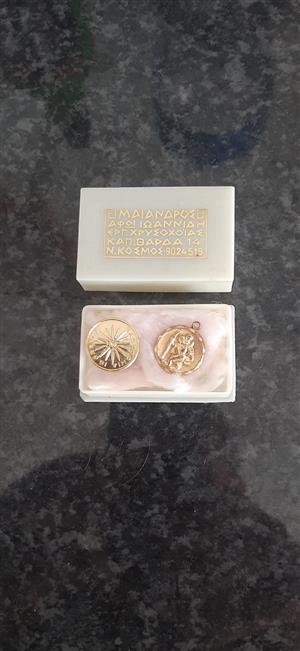 Gold Saint Christopher pendant and a Vergina Sun charm
