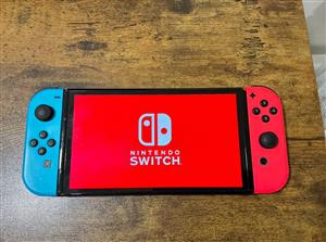 Nintendo Switch OLED + Case + Game