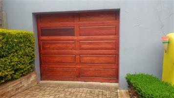 Wooden garage door and motor