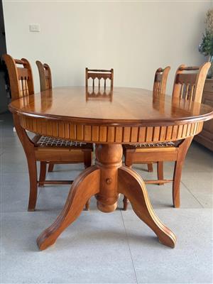 Red American Cherry wood dining table with 8 riempie chairs and side baord