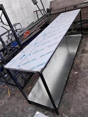Stainless steel top tables 570x2450mm 900mm high.