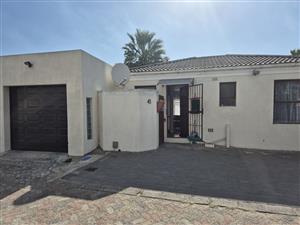 Modern 2-Bedroom Home with Automated Drive-Through Garage & Prime Location!