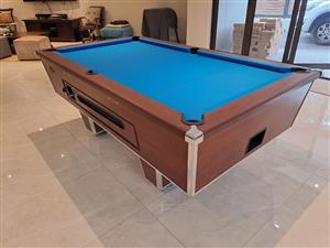Brown Hurricane Coin Pool Table for sale.