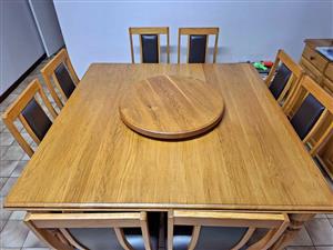 8 Seater Solid Oak table with lazy suzing and side board. Full leather chairs