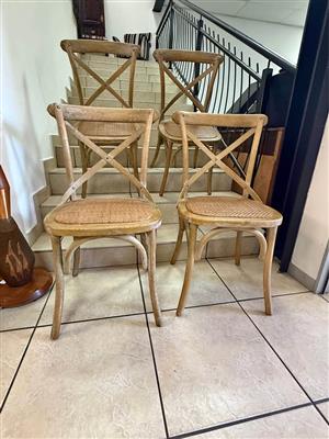 Cross-back dining chair with a woven rattan seat (priced per chair)