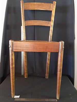 Ladder-back wooden chair.