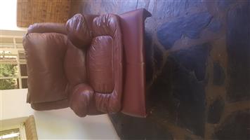2 maroon leather recliners
