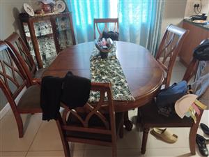 Dining room retractable table with 6 chairs. Double couch with two single couche