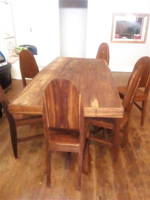 Hand crafted Namibian Dolf/kiaat wood table and six chairs