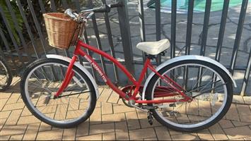 Adult, female , old style bicycle 