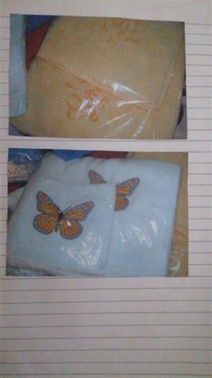 Embroidered clocks, sleeping bags for toddlers, embroidered cushions, rag dolls