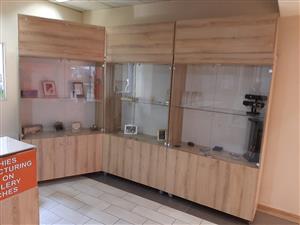 7 x shop front display cabinets + 1 desk. See full description below.