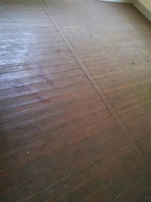 Stripping of old wooden floors and replacing with concrete floors 