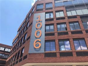 This first-floor unit has been “white boxed” with some offices that remained.