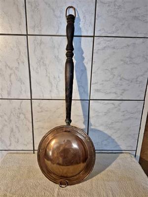 Vintage copper bed warmer.