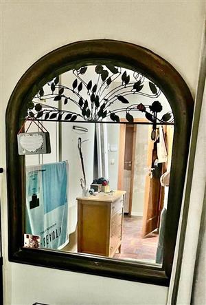 Arched wood framed mirror
