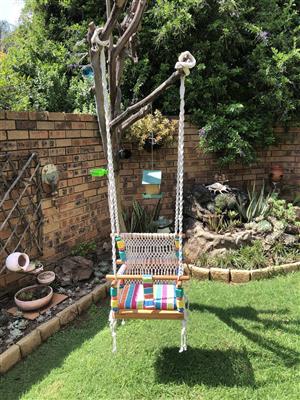 Handmade macramé baby swing 