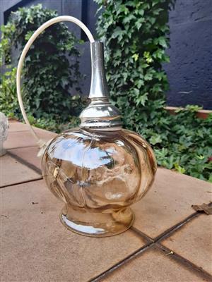 Vintage Murano glass lamp, characterized by its hand-blown glass body and metallic fitting. 