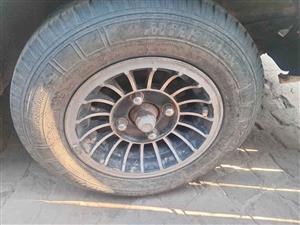 Nissan 1400 bakkie 3 rims n tyer size 155/12 inches  for sale @ Circle 7 used parts