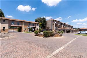 Secure 1 Bedroom Unit for Sale in Kempton Park with 24/7 Security and a pool in the complex.