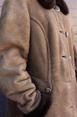 Shearling sheepskin coat. Genuine leather and wool. Heavy, long and warm.
