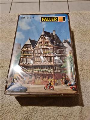 Scale model kit of two old city buildings.