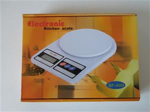 Kitchen Scale Electronic  SF-400. Brand new in a box. With 2 brand new bartteries included.