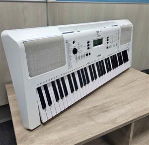 White Yamaha EZ-300 beginner portable keyboard