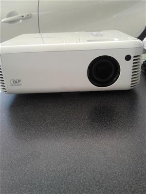 Optoma projector.Portable screen and speakers and woofer 