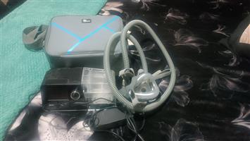 Sleep apnea machine with medium and large masks.