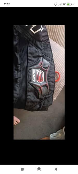 Shift off road riding pants and Thor upper body protector gear 