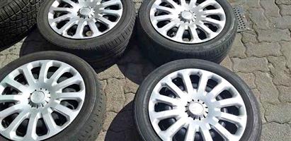 Four 15 inch Ford fiesta standard rims,tyres & wheel caps for sell