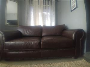 Genuine leather 2 seater couch for sale.