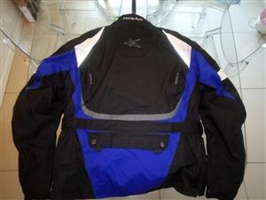 Almost new Mens Medium Assualt Jacket with protective joint and back inserts wit