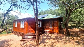 Charming Wooden Home for Sale in Boschhoek Mountain Estate - A Nature Lover's Dream!