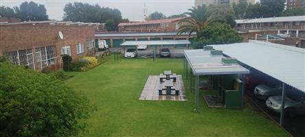 Neat Facebrick Home with Covered Patio and Communal Garden
