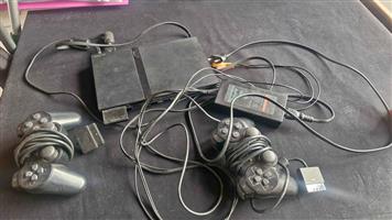 Ps 2 with 2 remotes all cables and memory card