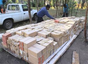 Factory left-over stock of handcrafted glazed clay tiles in multiple colours