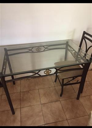 Four seater dining table with one chair