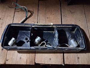 Tail light holder, older vehicle