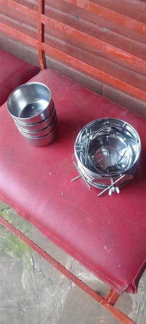 Stainless steel small and large bird cage feeder bowls.